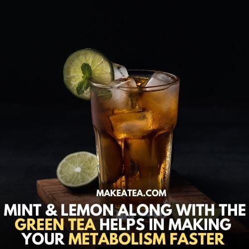 A glass of iced green tea with lemon and mint