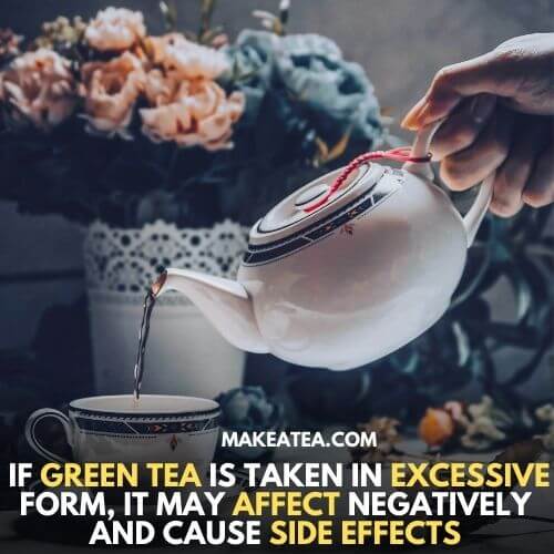 A tea pot pouring green tea in a cup