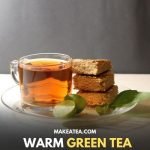 A cup of warm green tea with snacks