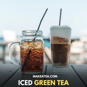 A cup if iced green tea with a straw