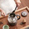 9f7fc3b1-7fab-4f2d-a303-14dd0b66c459.jpg Tea Cooker Health Pot Mini Steam Spray Stainless Steel Electric Kettle